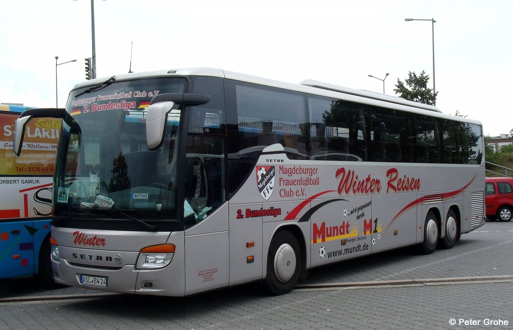 Setra S 416 GT-HD von Omnibus- und Taxiunternehmen Bernd-Achim Winter aus Egeln mit Werbung f�r Magdeburger Frauenfu�ball Club e.V. und Mundt Energie-Service, fotografiert am Hauptbahnhof Dessau am 07.07.2012
