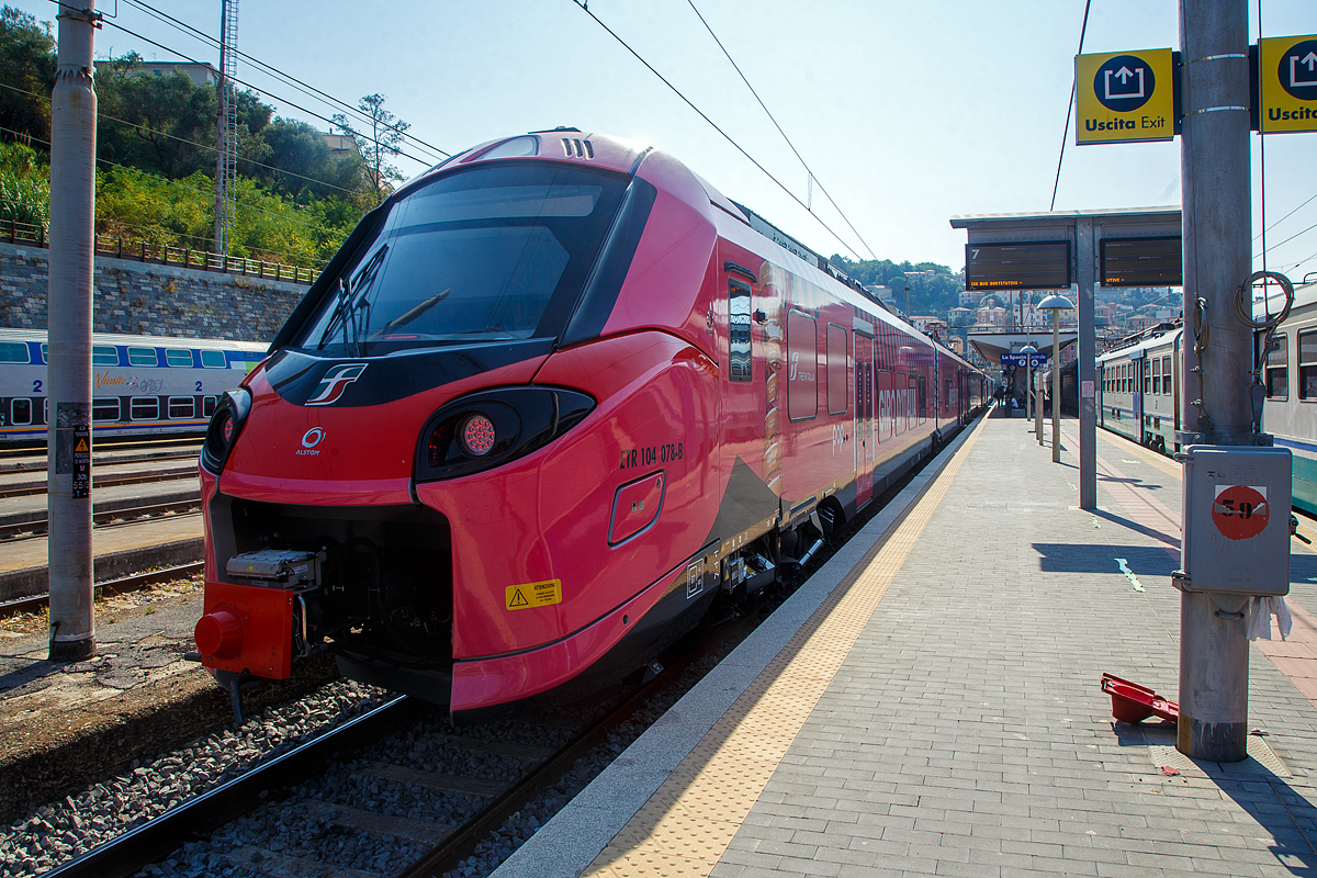 Zwei gekuppelte Trenitalia „pop“, der ETR 104 078 und hinten der ETR 104 070, zwei vierteilige Alstom Coradia Stream, mit Werbung fr den Giro d’Italia, stehen am 21.07.2022 im Bahnhof La Spezia Centrale, als Cinque Terre Express (Regionale) via Riomaggiore, Manarola, Corniglia, Vernazza und Monterosso nach Levanto, zur Abfahrt bereit.

Fr die Fahrt mit den Cinque Terre Express muss man ein Ticket lsen, z.B. Trenitalia nationale Tageskarten gelten hier nicht.
