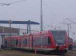 2xErdbeer-Joghurt alias 646 von DB-Regio Brandenburg warten als berfhrung von Rostock Hbf Richtung Berlin-Lichtenberg im BW Rostock Hbf.