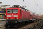 Berlin, wir fahren nach Berlin hie es am 29.04.2012 114 033-4 mit dem Fuballsonderzug von Rostock Hbf nach Berlin Schnefeld Flughafen kurz vor der Ausfahrt im Rostocker Hbf