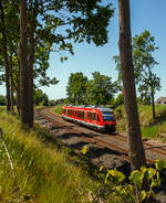 Der Dieseltriebzug 648 957 / 648 457 (95 80 0648 957-8 D-DB / 95 80 0648 457-9 D-DB) ein Alstom Coradia LINT 41 der DB Regio, als RB 85 (Lübeck - Sierksdorf - Oldenburg in Holstein - Puttgarden), fährt am 12.06.2015 von Großenbrode weiter in Richtung Fehmarnsundbrücke.