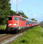 110 493-4(DB Regio NRW GmbH Dortmund)mit DZ 2680/2681 Warnemnde-Berlin-Lichtenberg-Potsdam-Warnemnde bei der Durchfahrt im Bahnhof Rostock-Bramow.(25.05.2011)