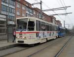 Tatra-Straenbahn vom Typ T6A2 mit Bildern von Zeitungsausschnitten ber den Mauerfall fhrt als Linie 1 von Hafenallee,Rostock Richtung Rgener St.,Rostock Aufgenommen am 10.03.10 in der Haltestelle