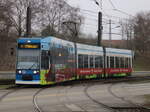 6N-1 Wagen 668 mit der Molli Werbung am 21.12.2025 in Höhe Rostock-Stadthalle.