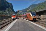 In Faido begegnen sich der einfahrende SOB Flirt3  Travers  RABe 526 216 als IR26 2319 Treno Gottardo auf dem Weg von Zürich nach Locarno und der durchfahrende SBB RABe 501 027-7  Schaffhausen 