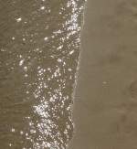 Wasser, Sand und die glitzernde Sonne.
(Juni 2009)
